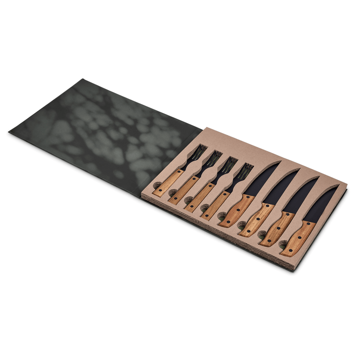 Ermelo steak knife and fork set in a stylish box with wooden handles and sleek black blades.