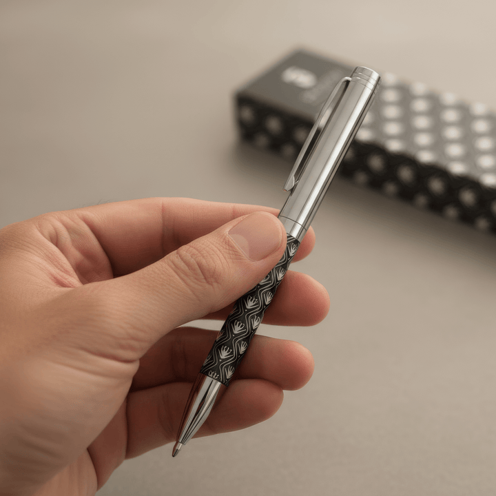 Sengetti Protea Heritage Ball Pen held in hand, showcasing chrome plating and Protea pattern, from Andy Cartwright Collection.