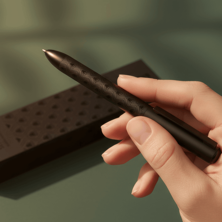 Sengetti Protea Signature Ball Pen held in hand, showcasing its elegant design and matte black finish.