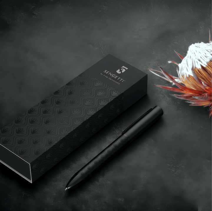Sengetti Protea Signature Ball Pen in elegant packaging with a striking Protea flower background.